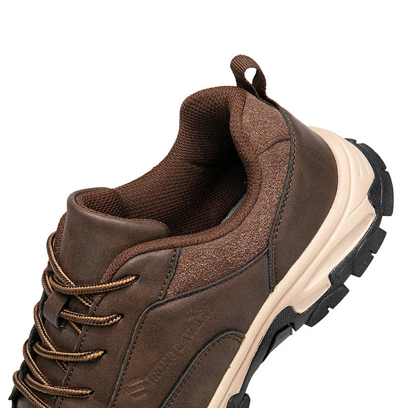 Brown hiking shoe with padded collar, textured laces, and rugged beige sole on white background