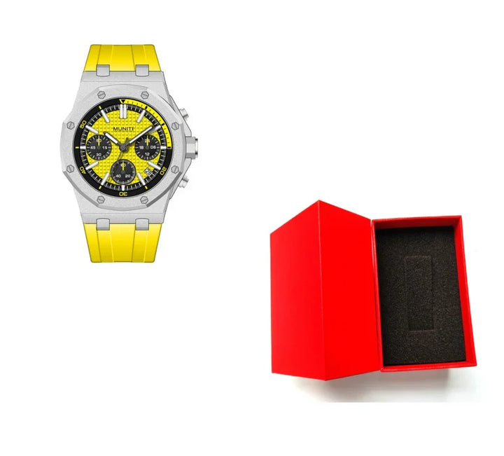Yellow Munte wristwatch with black dial and silver bezel next to an open red watch box with black foam