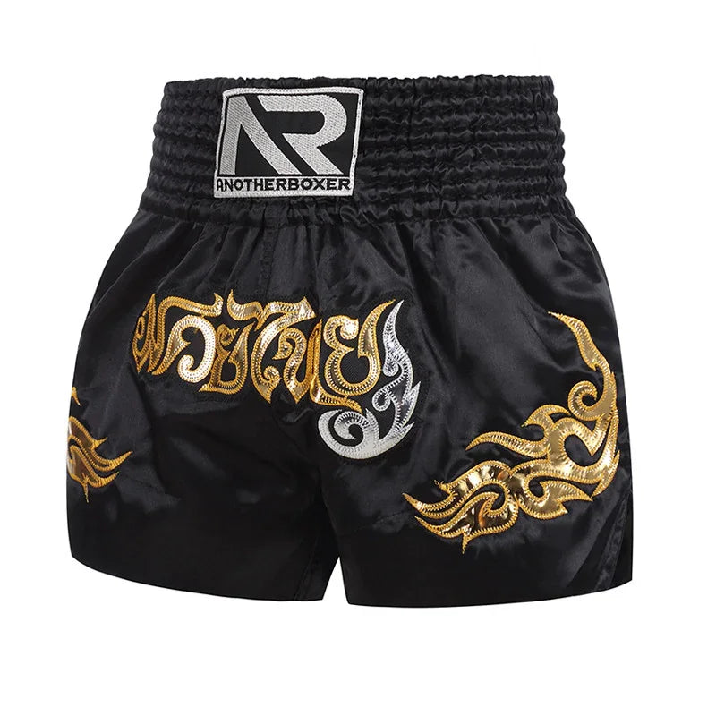 Black Muay Thai shorts with gold and silver embroidery and Anotherboxer logo patch