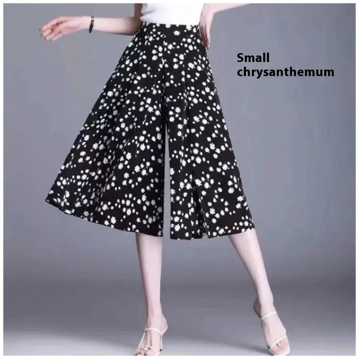 Black wide-leg culottes with small white chrysanthemum floral print worn by model