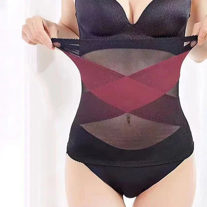 Woman wearing black high-waisted shaping underwear with red crisscross accents