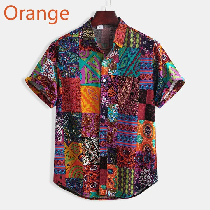 colorful short-sleeve button-up shirt with patchwork paisley and geometric patterns on hanger