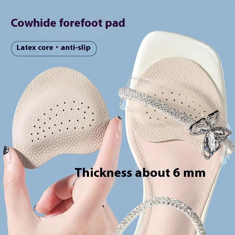 Cowhide forefoot pad held by hand, shown inside a sandal with clear straps and butterfly decoration, anti-slip latex core