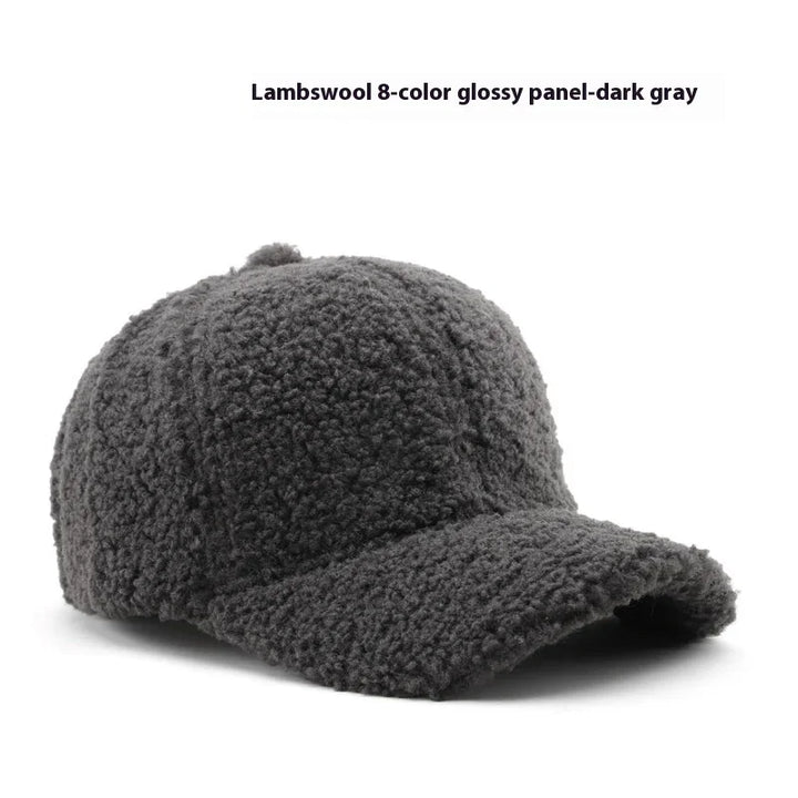 Dark gray lambswool textured baseball cap with a curved brim on white background
