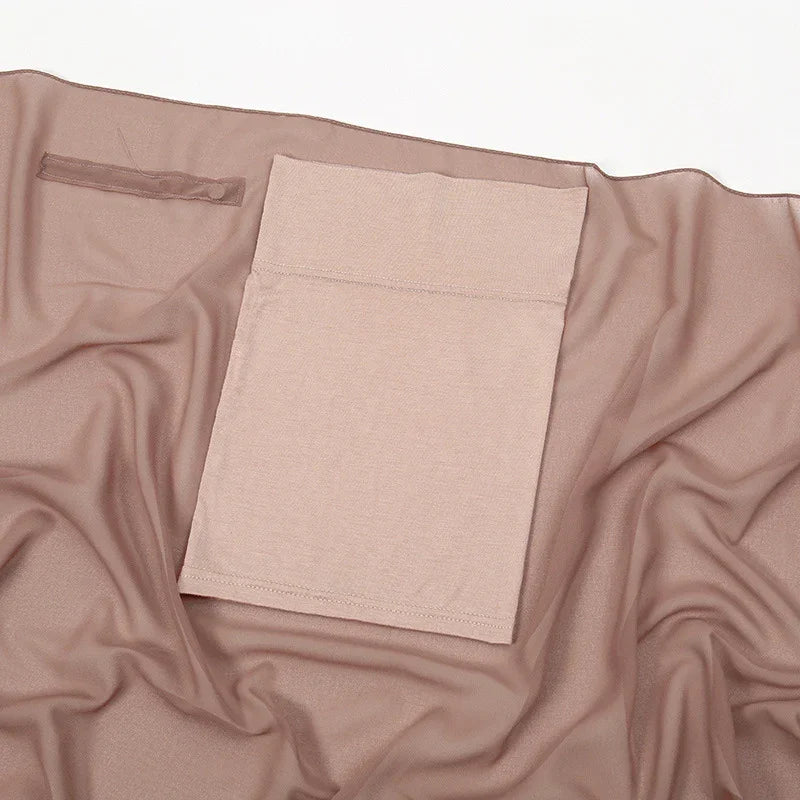 Beige seamless shapewear garment laid flat on matching fabric background