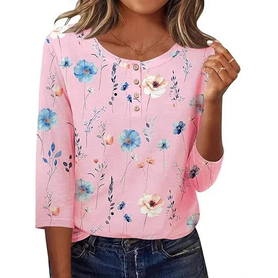 woman wearing pink floral print 3-button 3/4 sleeve blouse with blue and white flowers