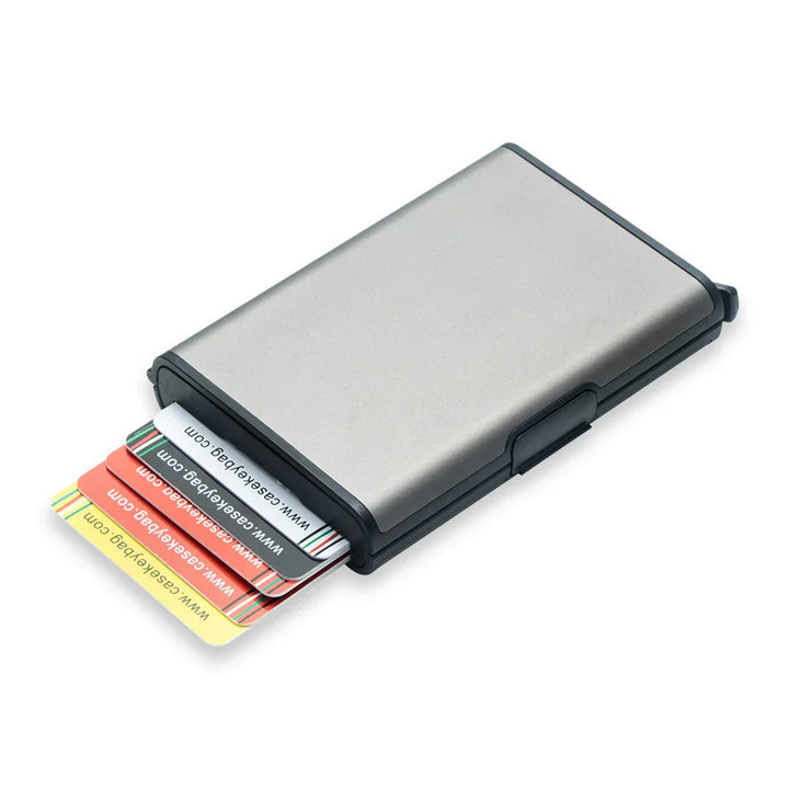 Silver and black metal cardholder case with multiple colorful plastic cards partially pulled out