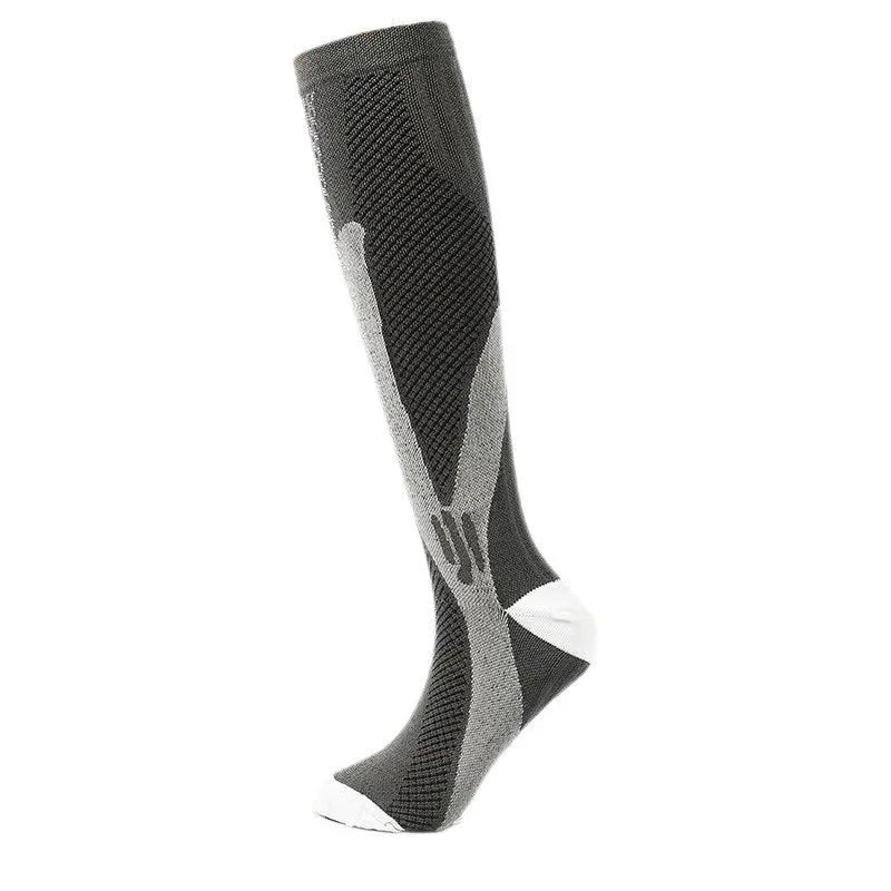 black and gray knee-high compression sock with white toe and heel accents