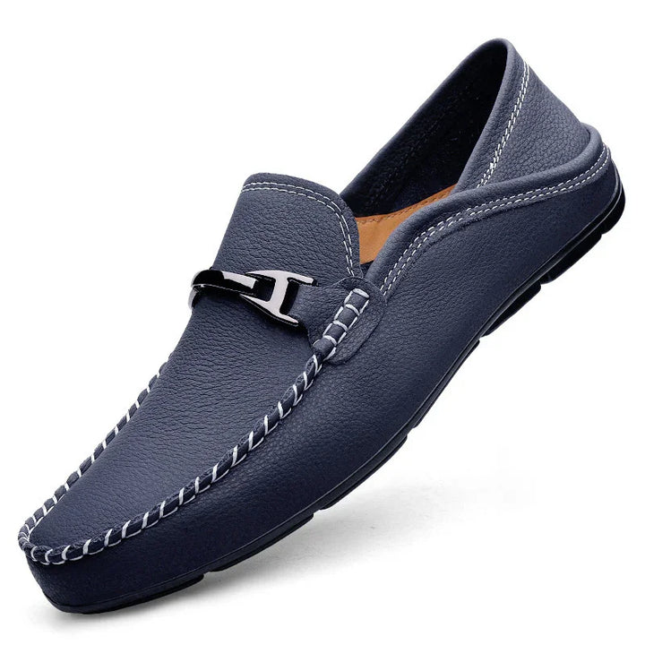 Navy blue leather men's loafer with white stitching and black metal buckle detail