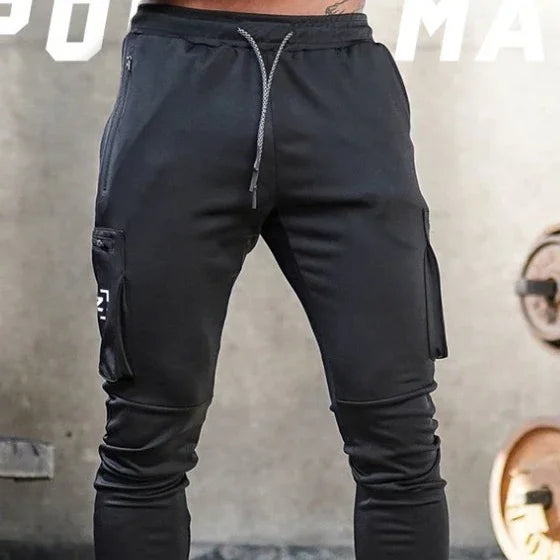 Men's black jogger pants with zippered pockets and drawstring waist, fitness style