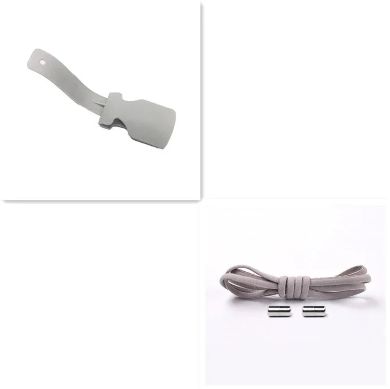 Grey silicone shoe horn, elastic shoelace, and two silver shoelace tips on white background