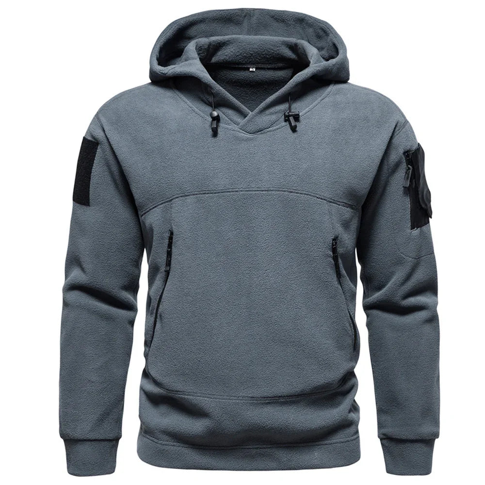 Gray fleece tactical hoodie with zip pockets and arm patch, front view on white background