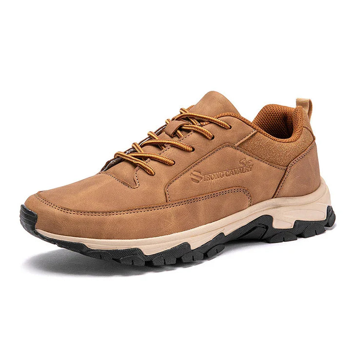 Brown casual leather sneaker with textured black sole and embossed Strong Cavalry branding