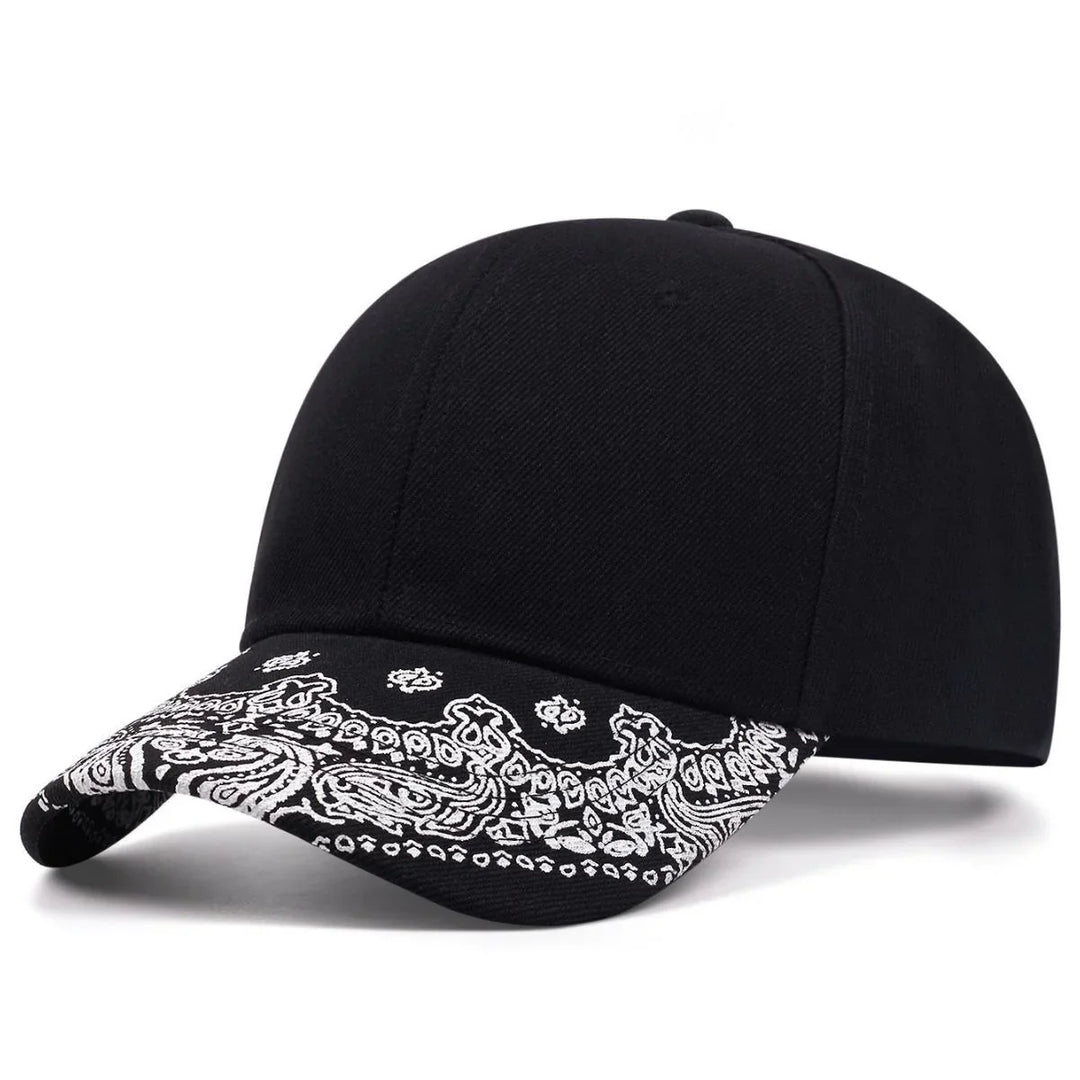 Black baseball cap with curved brim featuring white paisley bandana print