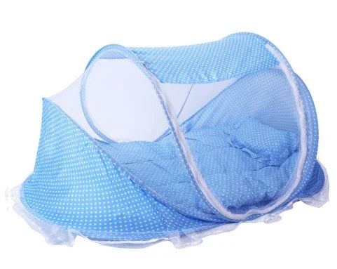 Blue polka dot baby bed with built-in mosquito net and soft mattress