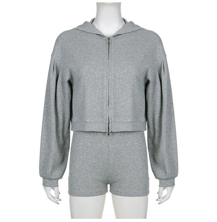 Gray ribbed knit zip-up hoodie with balloon sleeves and matching high-waist shorts on mannequin