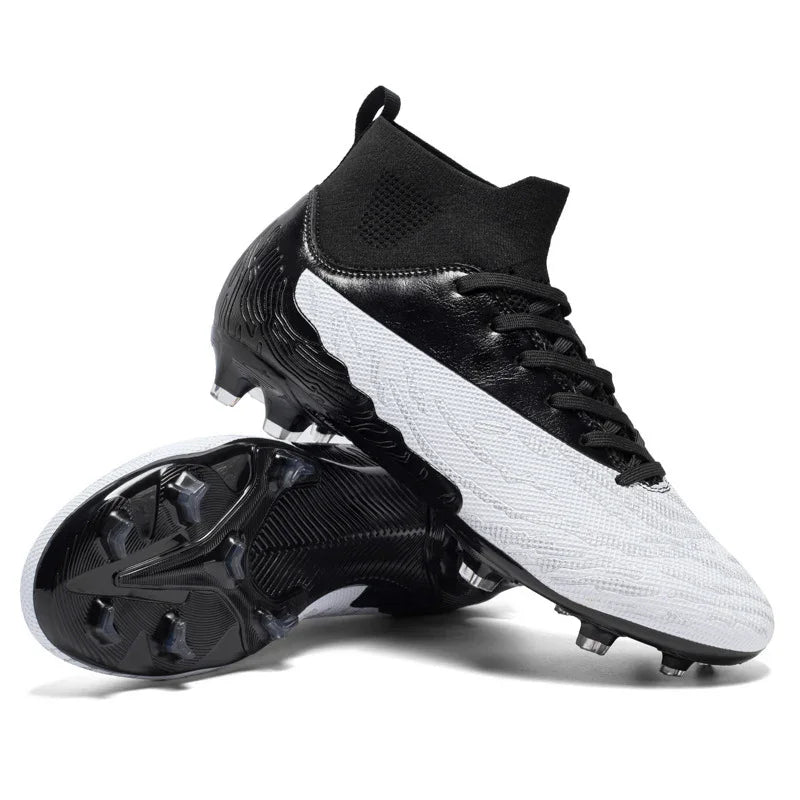 Black and white soccer cleats with high ankle collar and textured sole studs on white background