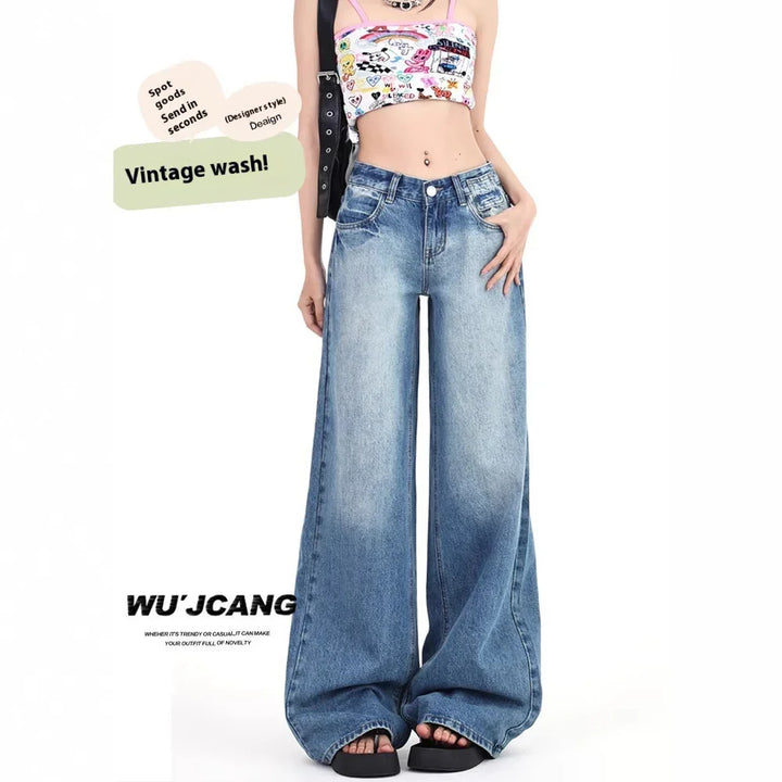 Woman modeling vintage wash wide-leg jeans with graphic crop top and platform sandals