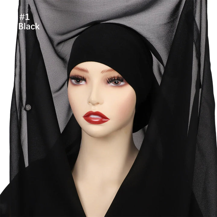 Mannequin with black inner hijab cap and sheer black veil fabric backdrop