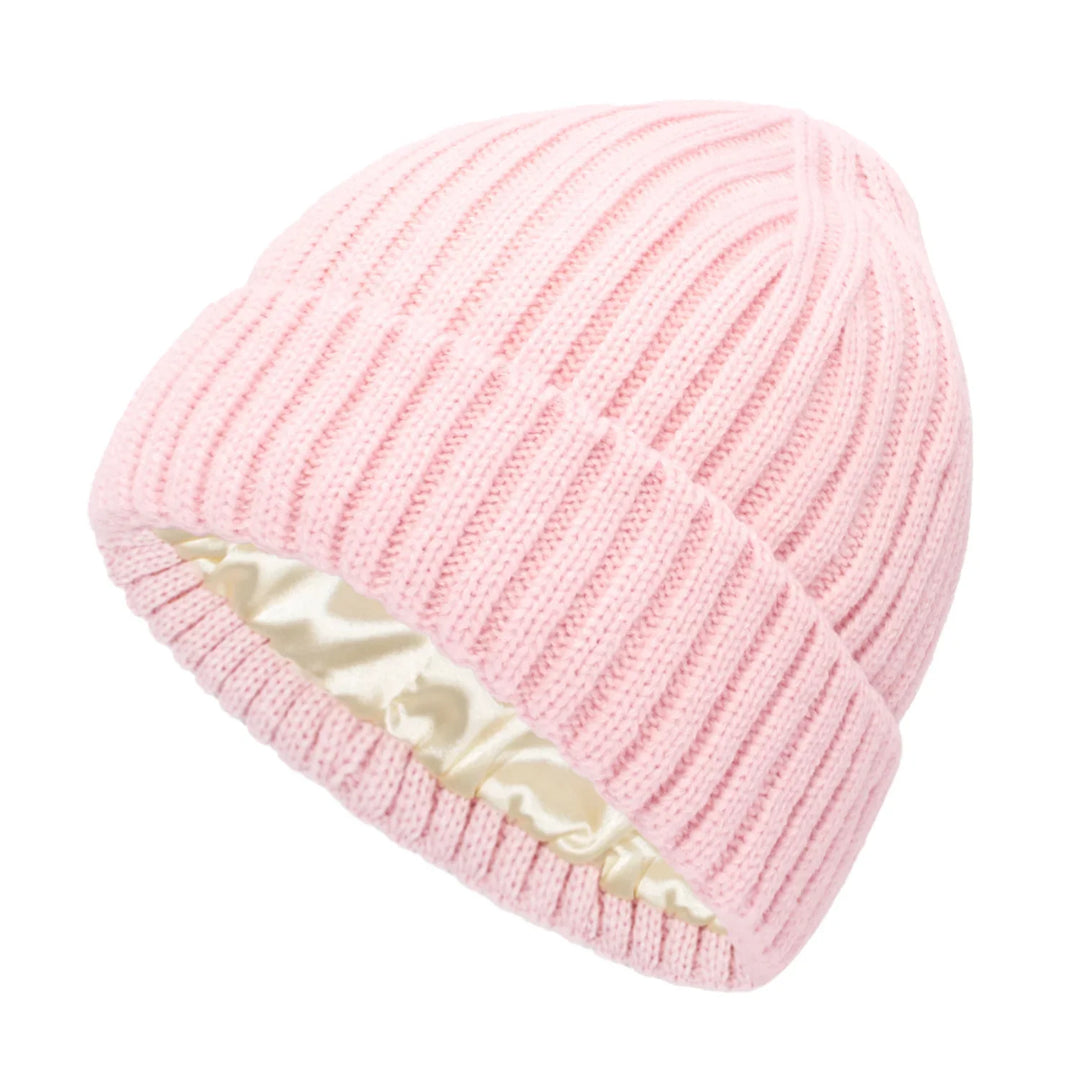 Soft pink ribbed knit beanie hat with cream satin lining