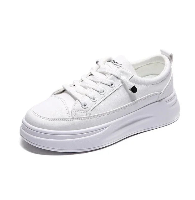 White platform sneaker with thick sole and lace-up design on white background