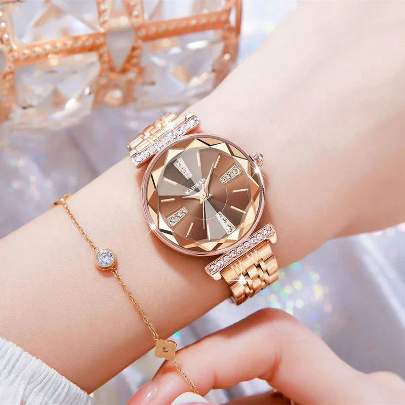 Rose gold luxury women's wristwatch with a faceted crystal dial and diamond accents on metal bracelet