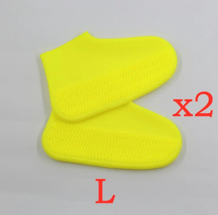 Pair of large yellow silicone shoe covers with textured soles on gray background marked x2