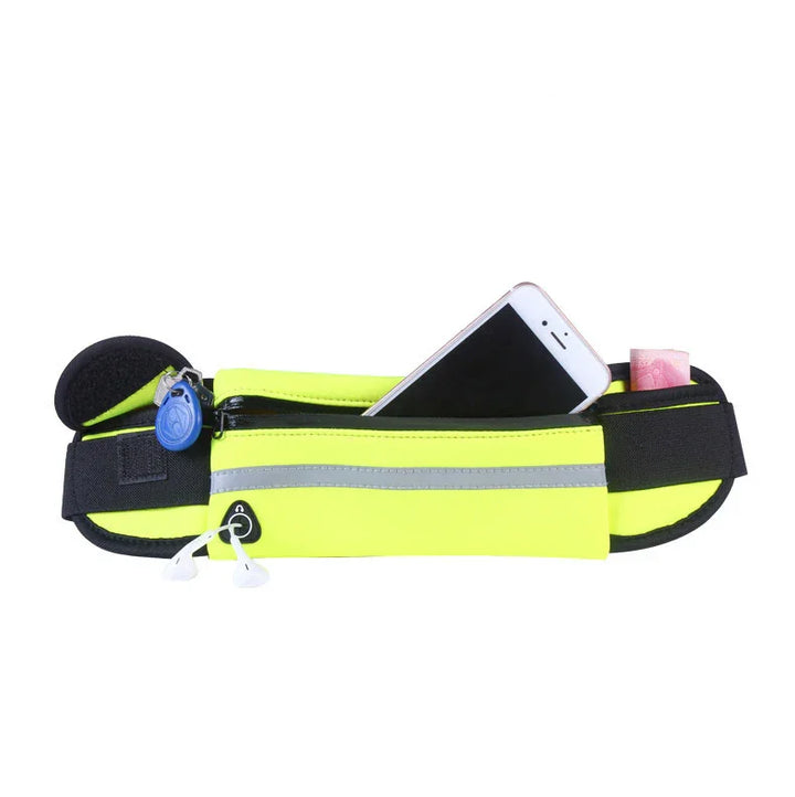 Bright yellow running belt with reflective strip holding smartphone, cash, key fob, and earphones