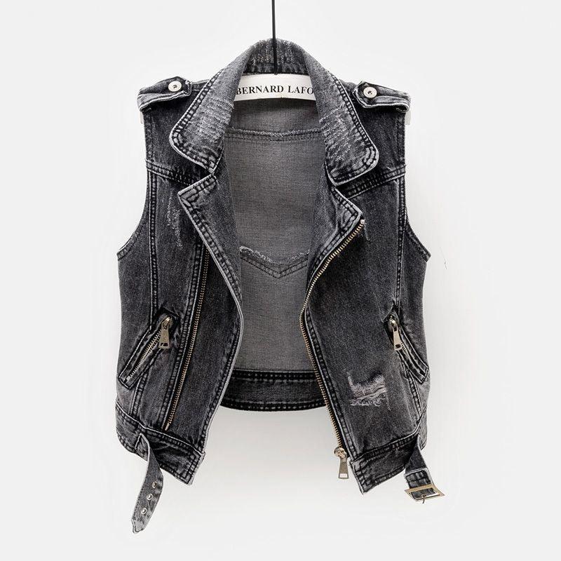 Black distressed denim sleeveless biker vest with zipper and buckle details on hanger