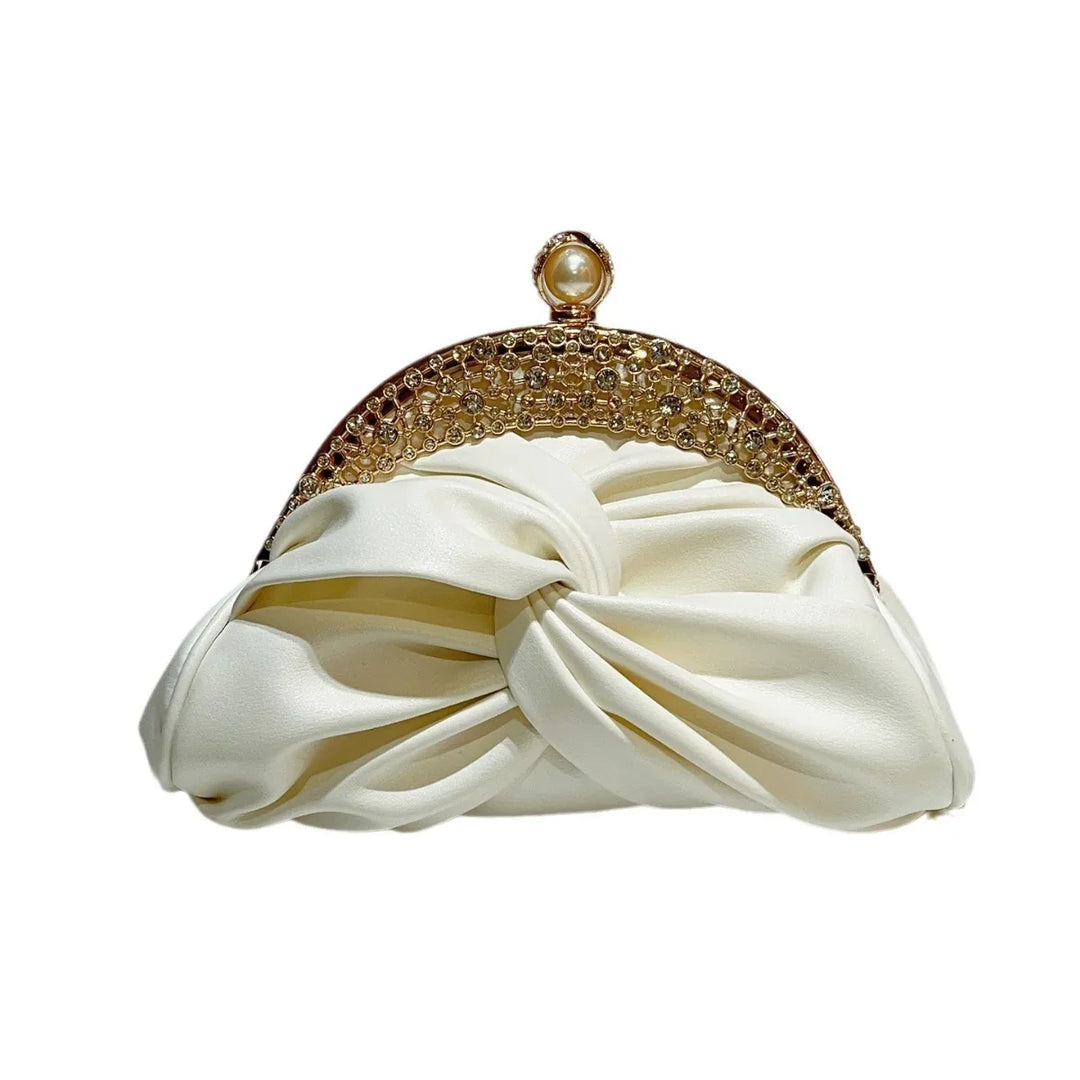 Elegant white satin clutch purse with gold jeweled frame and pearl clasp