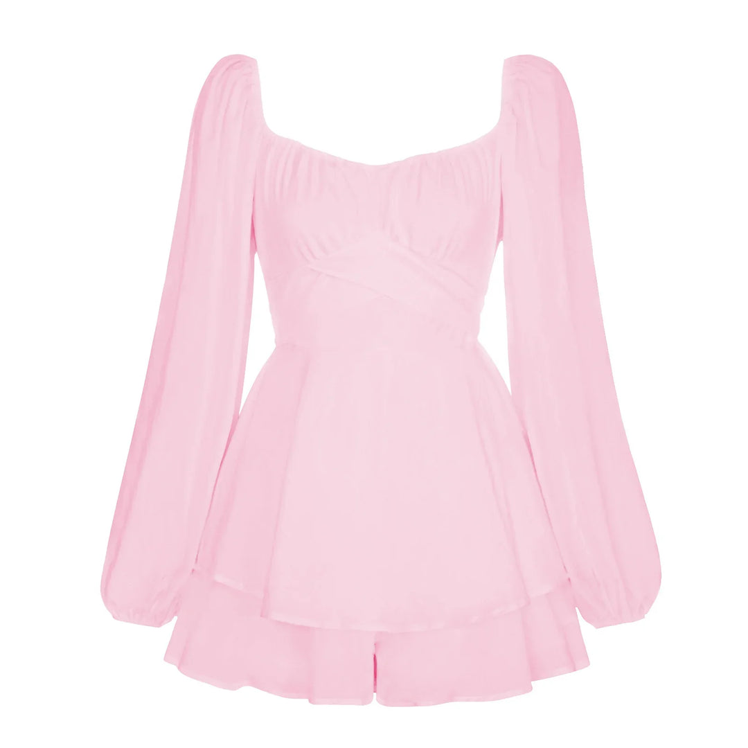 Pink long-sleeve romper with square neckline and flowy layered skirt design