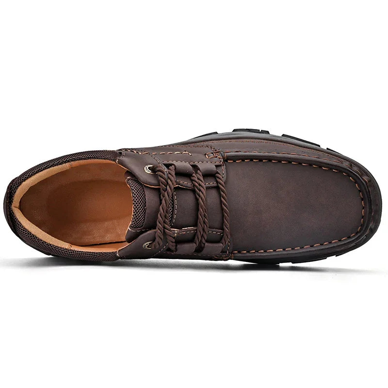 Top view of brown leather casual men's shoe with braided laces and stitched details