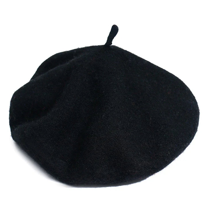 Classic black wool beret with small top stem on white background