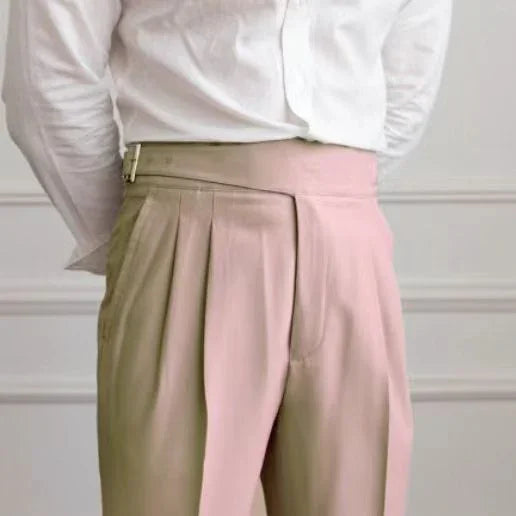 Two-tone beige and blush pink high-waisted pleated trousers worn with white shirt