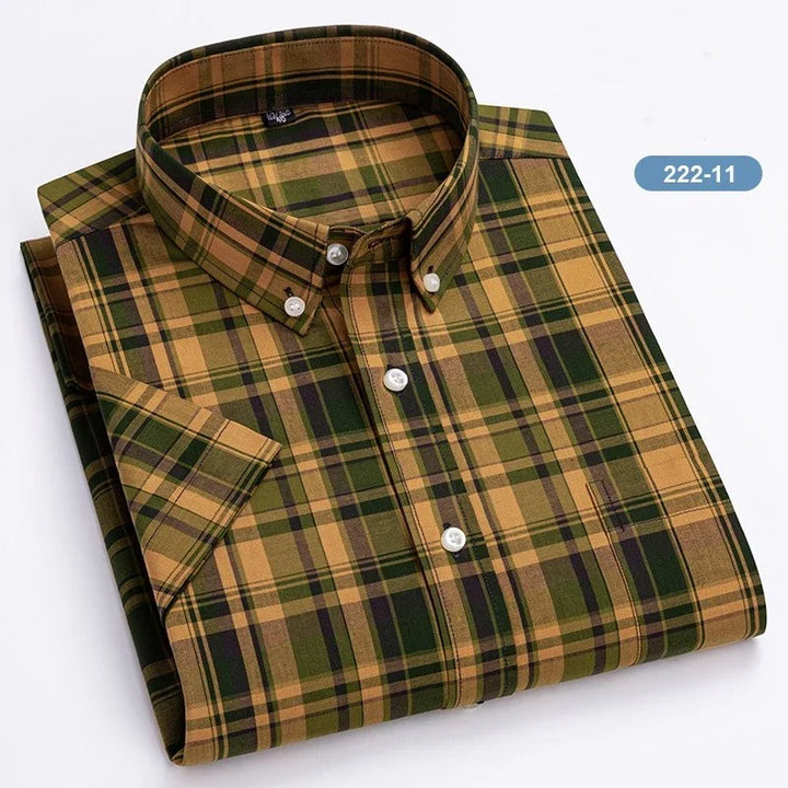 Folded short sleeve button-down plaid shirt in green and tan colors with white buttons