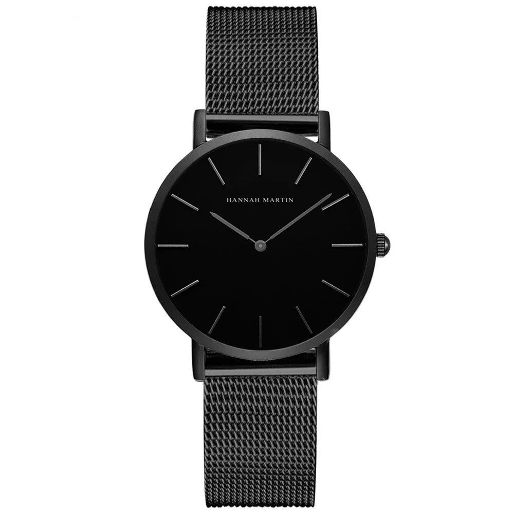Minimalist black wristwatch with mesh strap and simple dial by Hannah Martin