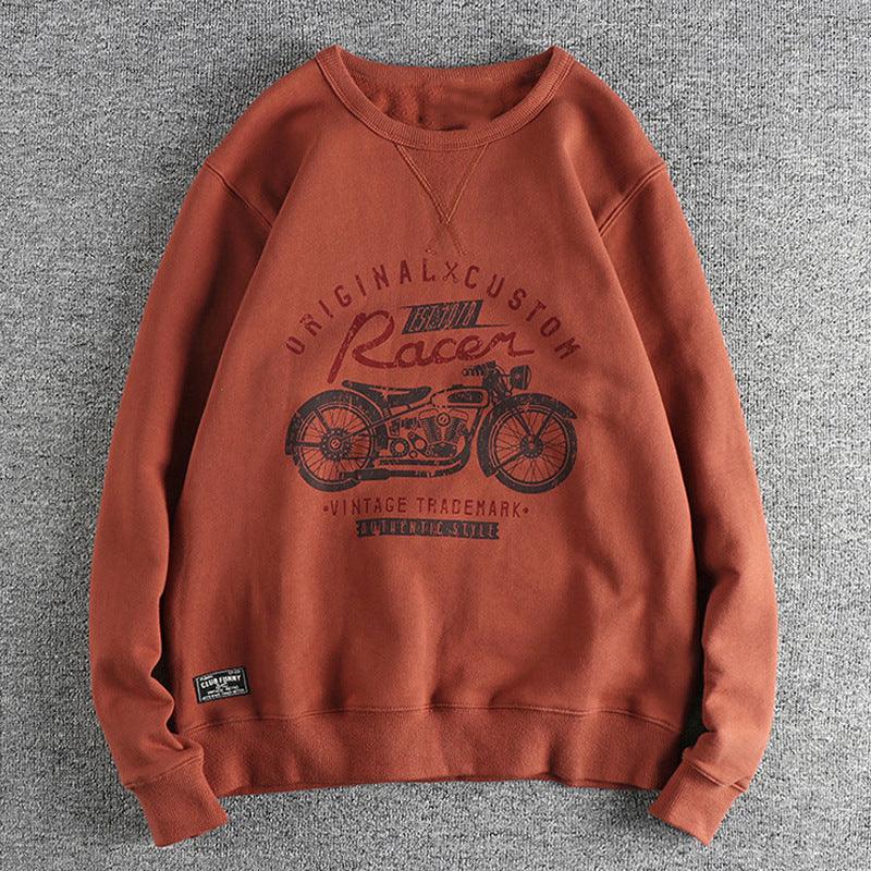 Rust-colored vintage racer motorcycle graphic sweatshirt with original custom print on gray background