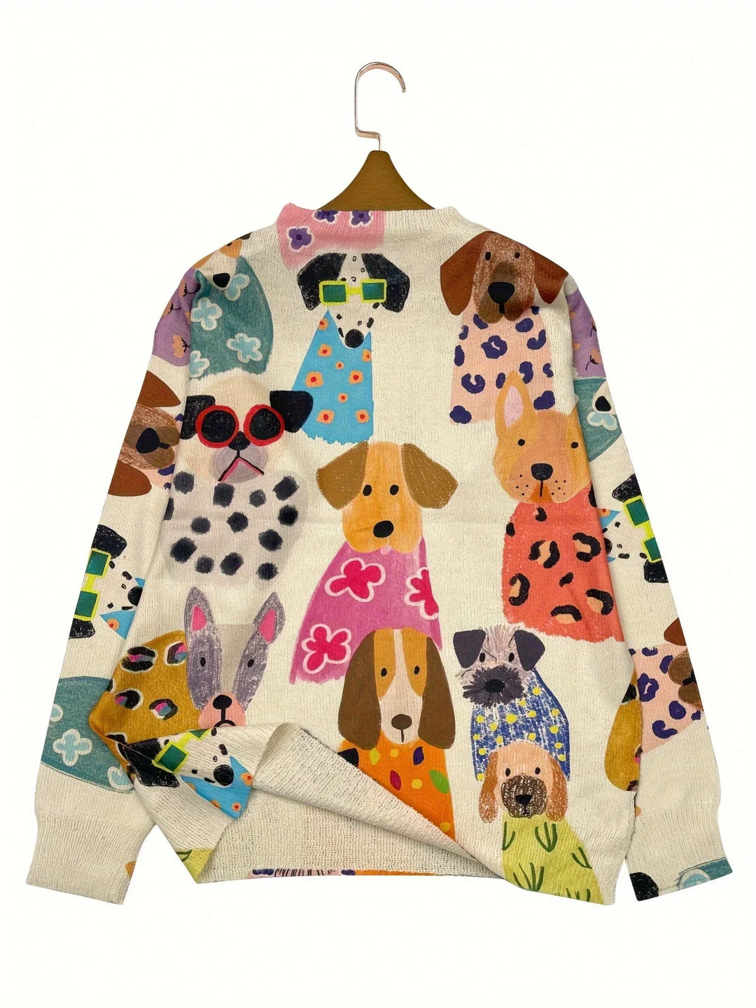 Cream knit sweater with colorful cartoon dog illustrations wearing glasses and patterned outfits