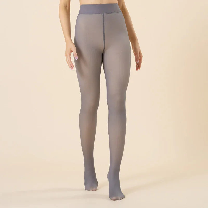 Woman wearing high-waist sheer gray tights with opaque waistband on beige background