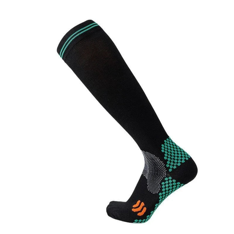 Black knee-high compression sock with turquoise grip dots and orange logo on foot