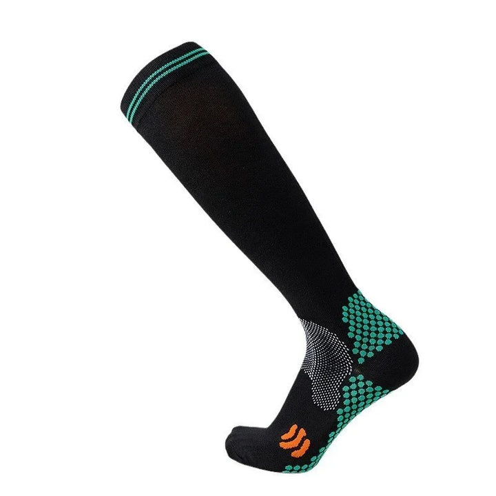 Black knee-high compression sock with turquoise grip dots and orange logo on foot
