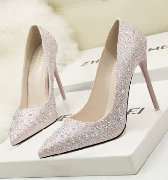 Elegant sparkling pink high heel pumps with rhinestone embellishments on white box