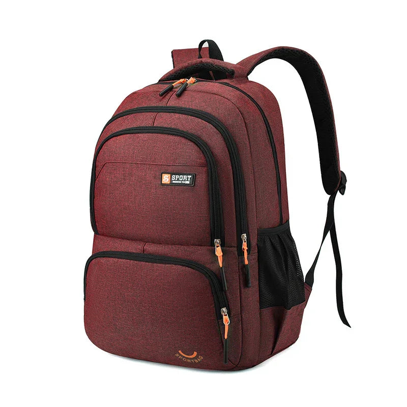 Maroon sport backpack with multiple compartments, black zippers, and mesh side pocket