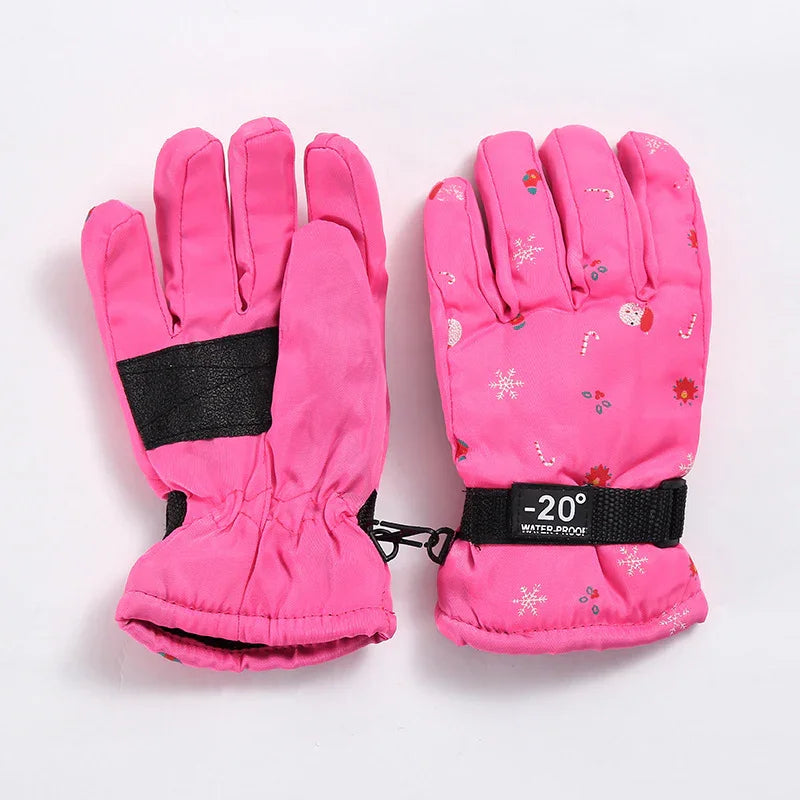 Pink waterproof winter gloves with snowflake and candy cane print and -20° label