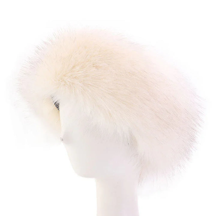 White fluffy faux fur beret hat displayed on white mannequin head