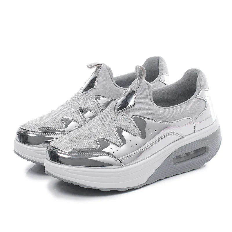 Silver and grey slip-on platform sneakers with mesh and shiny metallic accents