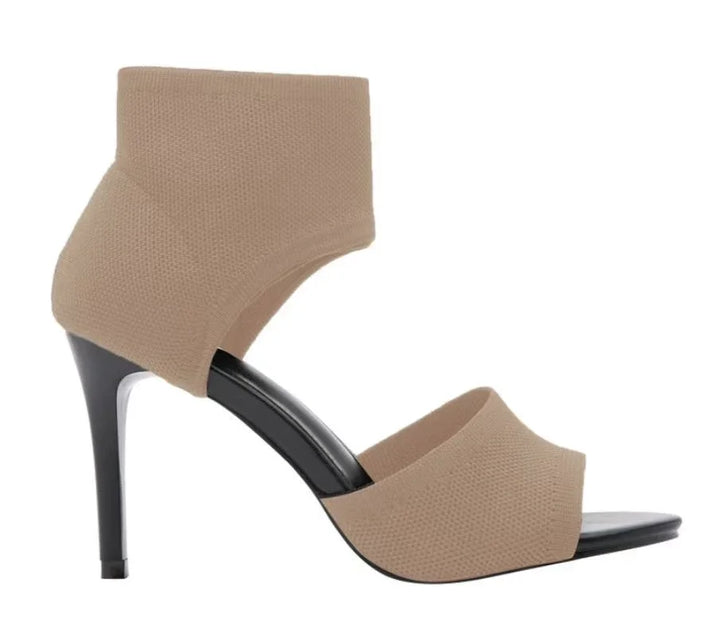 Beige ankle strap high heel sandal with black stiletto heel and open toe design