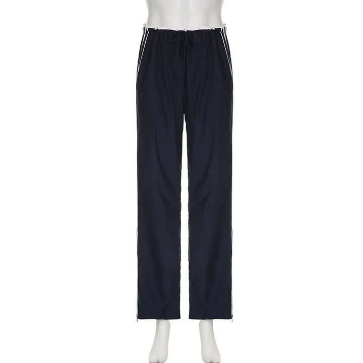 Navy blue athletic pants with white side stripes and drawstring waist on mannequin