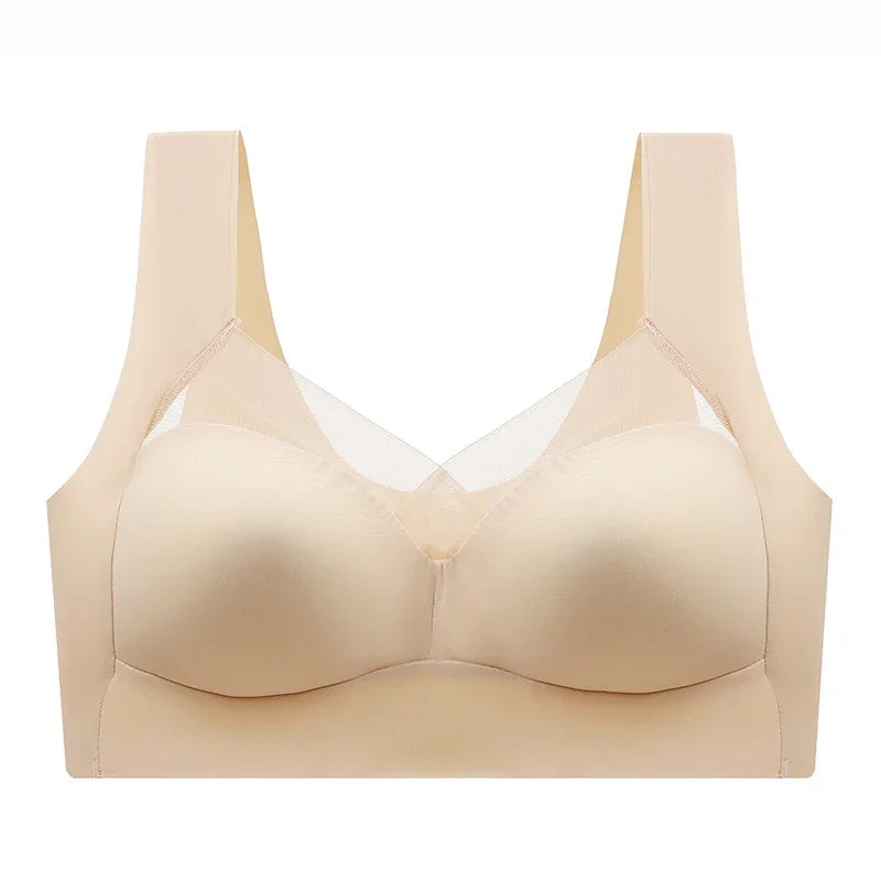 Beige seamless wireless bra with mesh detail and wide straps on white background