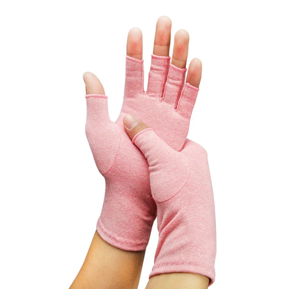 Hands wearing pink fingerless gloves made of soft fabric on white background